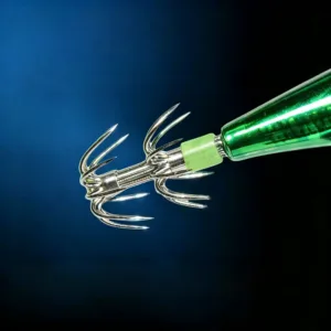 Closeup of stainless steel squid jig crown hook with green luminous tail ring on dark blue underwater background
