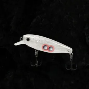 Translucent slow sinking minnow fishing lure with internal fixed weights and black treble hooks