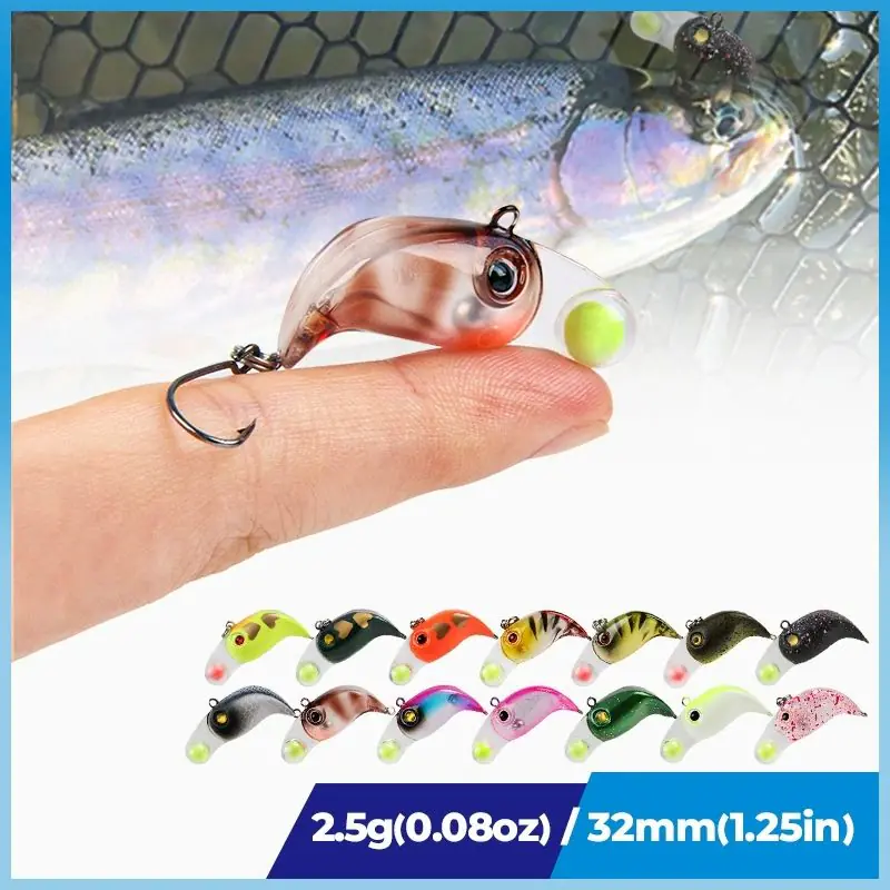 Person holding a mini micro VIB fishing lure on a fingertip showing 2.5g 32mm specifications and color options below